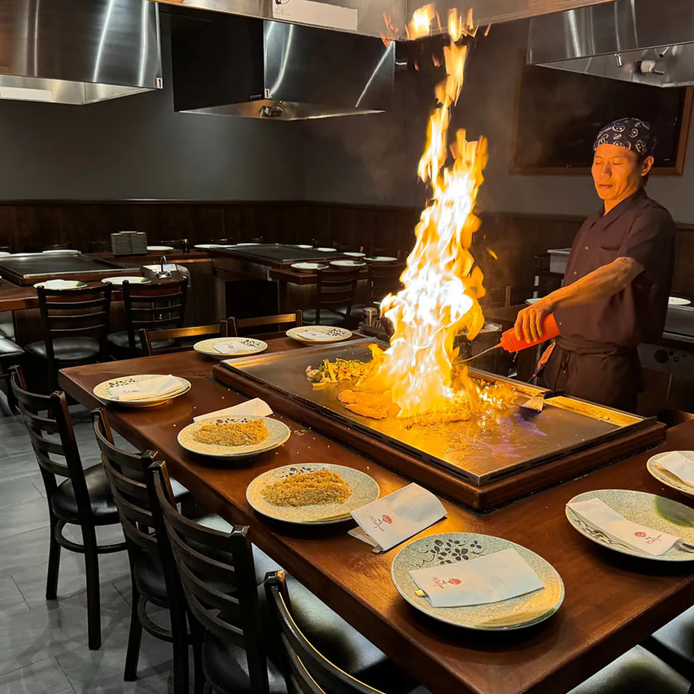 Teppanyaki chef’s flaming show at AJ Hibachi Steakhouse, an Asian Restaurant in Cheshire