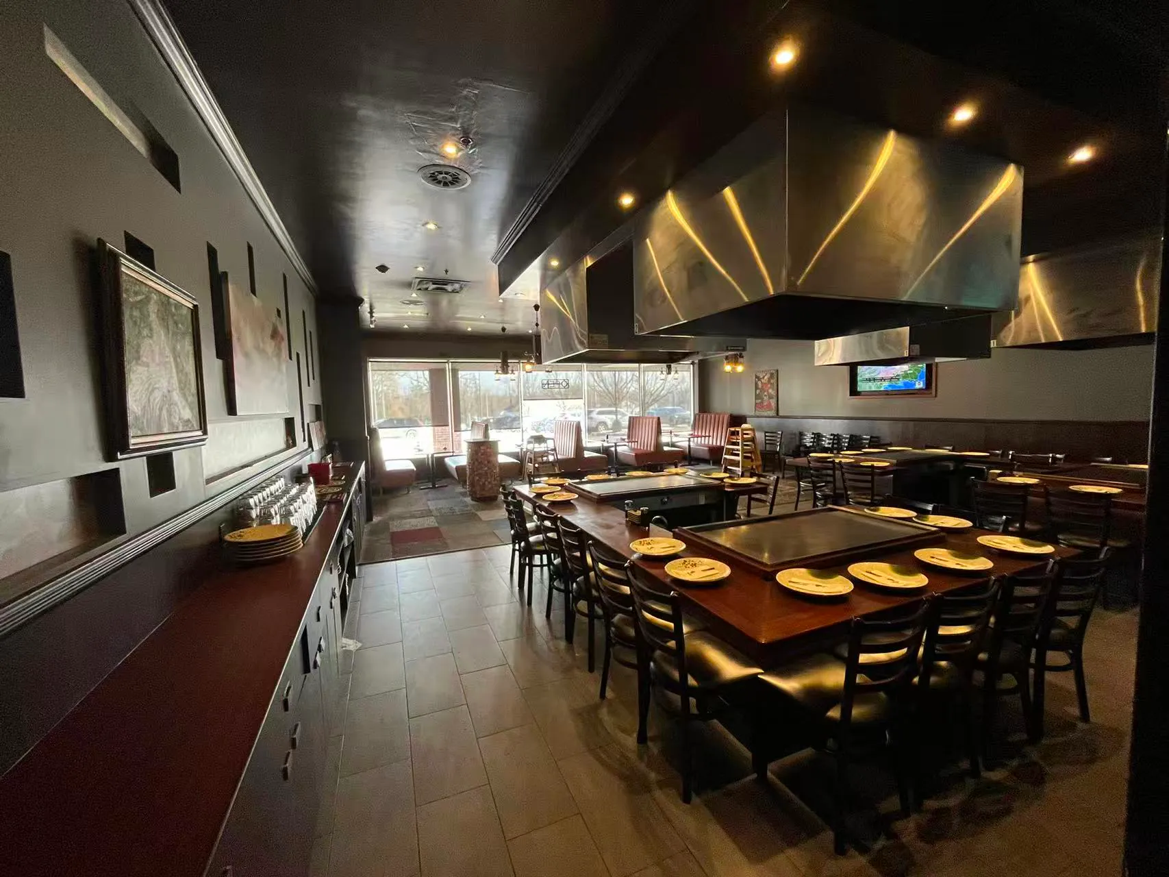 Teppanyaki dining area with griddle tables at AJ Hibachi Steakhouse, an Asian Restaurant in Cheshire
